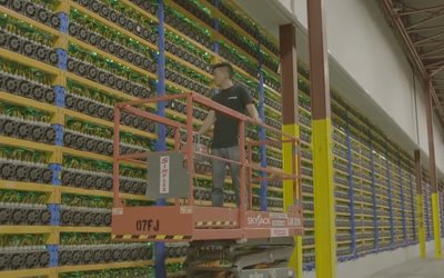 Modern mining farm deploying energy-saving Bitcoin miners with advanced cooling systems